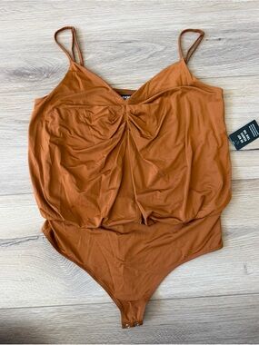 EXPRESS Rust Twist-Front body suit blouse